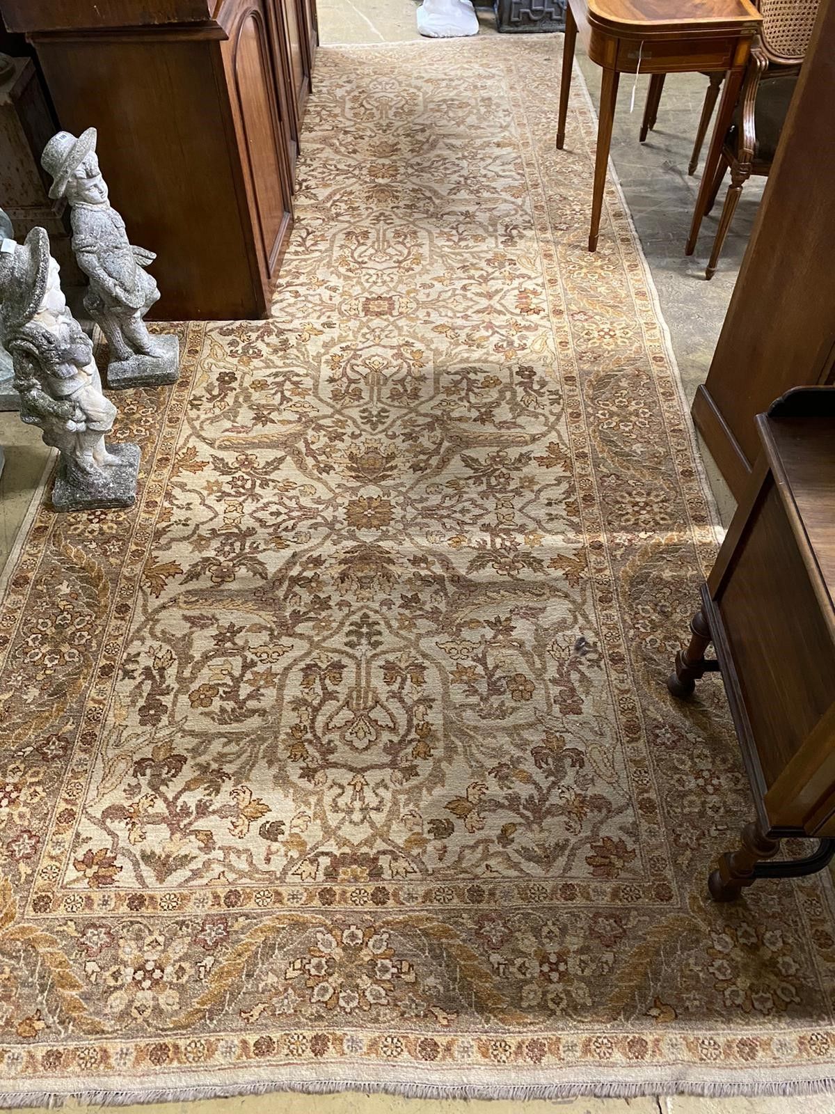 An Agra ivory ground carpet, 440 x 180cm